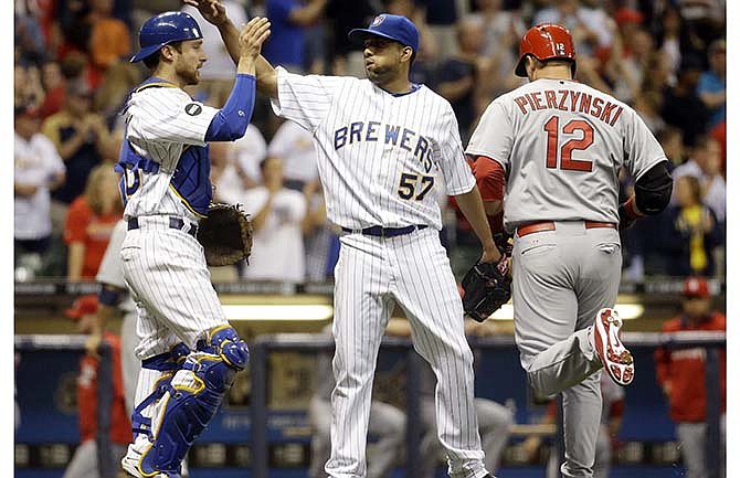 Milwaukee Brewers relief pitcher Francisco Rodriguez celebrates with catcher Jonathan Lucroy after getting St. Louis Cardinals' A.J. Pierzynski (12) out to end a baseball game Friday, Sept. 5, 2014, in Milwaukee. The Brewers won 6-2.