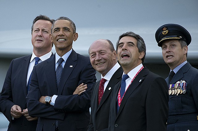 From left, British Prime Minister David Cameron, U.S. President Barack Obama, Romanian President Traian Basescu, Bulgarian President Rosen Plevneliev and British RAF Group Captain David Bentley watch a flypast on the second day of a NATO summit at the Celtic Manor Resort in Newport, Wales on Friday.