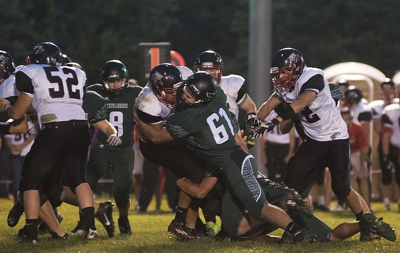 North Callaway junior defensive lineman Lance Starkey takes down a Bowling Green ball carrier during the Thunderbirds' 31-0 Eastern Missouri Conference loss to the Bobcats on Friday night in Kingdom City. 