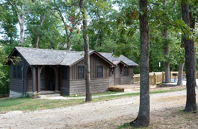 The former infirmary at Camp Pin Oak in Lake of the Ozarks State Park has been refurbished and now serves as an overnight sleeping cabin complete with heating, air conditioning, bathroom, refrigerator, microwave, coffee maker, deck, barbeque grill and concrete parking pads. The cabin along with two others are available for overnight guests.