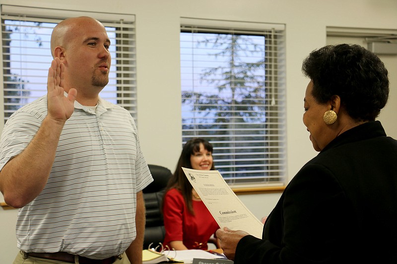 Holts Summit City Clerk Gwendolyn Edmonson swears in Jason Glenn to fill the unexpired Alderman term of Jason Michael at the board's September meeting Monday night.