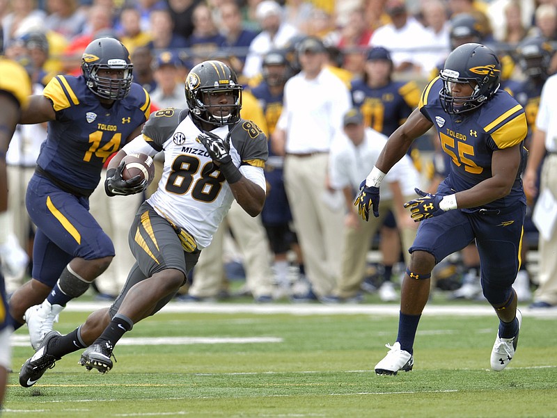 Jimmie Hunt, shown here running after a catch Saturday against Toledo, and the Missouri receivers have been taught what to do after an interception.