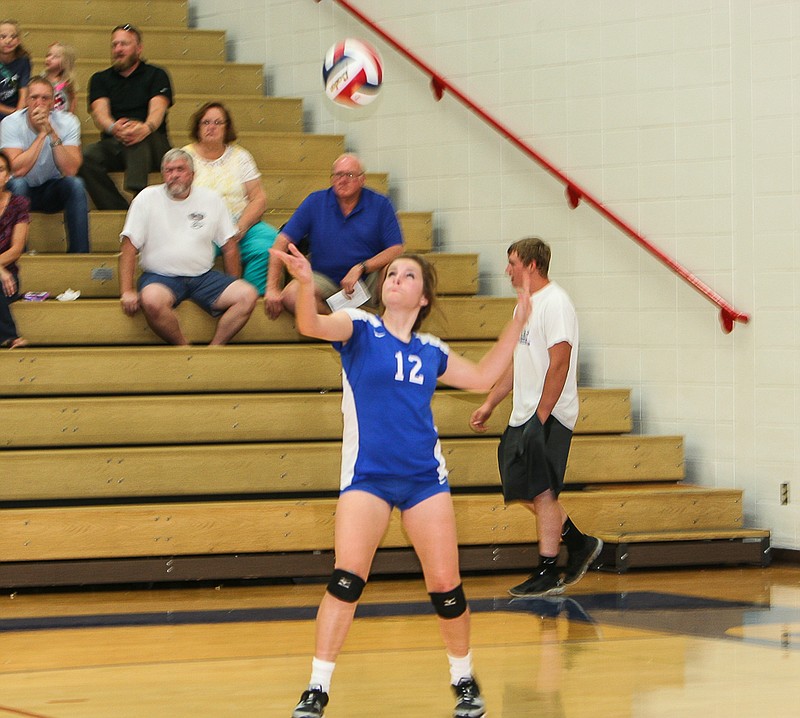 California's Chloe Schenewerk serves during the JVA match against Cole Camp Monday at California High School. The JVA and varsity lost to the Lady Bluebirds, while California's JVB defeated Cole Camp.
