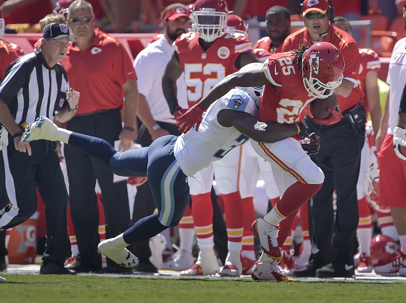Chiefs running back Jamaal Charles is tackled by Titans strong safety Bernard Pollard during last Sunday's game at Arrowhead Stadium.