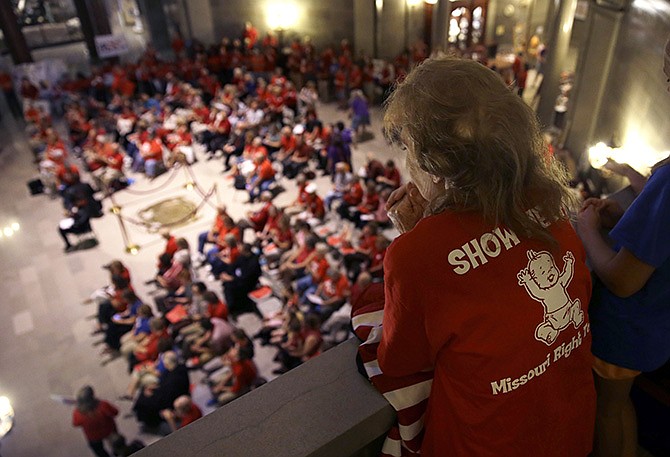 Elizabeth War looks over a gathering of her fellow abortion opponents in the Missouri Capitol rotunda Wednesday, as lawmakers considered whether to override a veto by Gov. Jay Nixon of legislation requiring a 72-hour waiting period for abortions.  