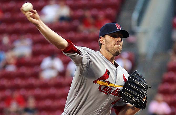 St. Louis Cardinals John Lackey pitches against the Cincinnati Reds in the first inning of their baseball game in Cincinnati, Wednesday Sept. 10, 2014.