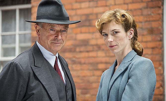 This photo provided by RLJ Entertainment/Acorn TV shows Michael Kitchen, left, as Christopher Foyle and Honeysuckle Weeks as Sam Wainwright, in a scene from "Foyle's War." The show is available on DVD and Acorn TV. 