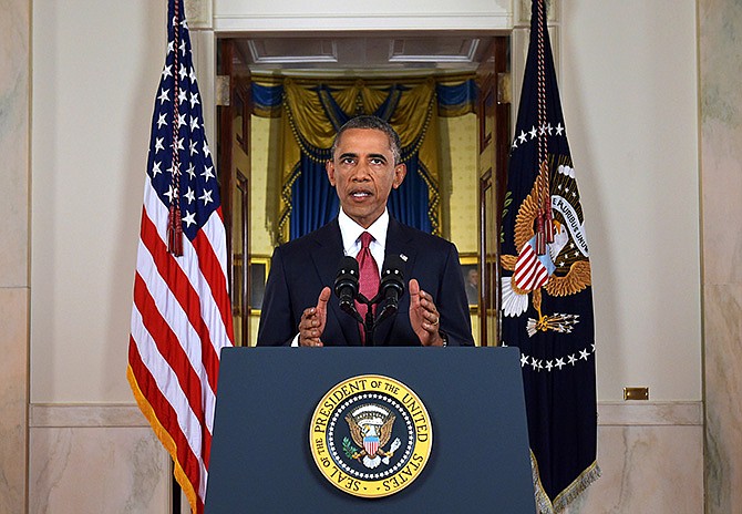 President Barack Obama addresses the nation from the Cross Hall in the White House in Washington, Wednesday. In a major reversal, Obama ordered the United States into a broad military campaign to "degrade and ultimately destroy" militants in two volatile Middle East nations, authorizing airstrikes inside Syria for the first time, as well as an expansion of strikes in Iraq. 