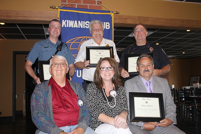 The Fulton Kiwanis Club payed tribute to emergency officials during its regular meeting Thursday afternoon. Back row, from left: Cpl. Jon Cluver with the Missouri State Highway Patrol, Fulton Fire Chief Dean Buffington and Fulton Police Chief Steve Myers. Front row, from left: Kiwanis President Bruce Carpenter, Incoming President Brenna Gough and Callaway County Sheriff Dennis Crane.