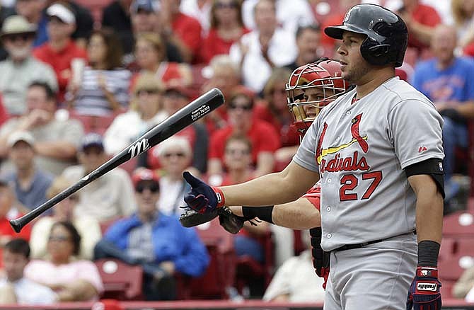 St. Louis Cardinals' Jhonny Peralta (27) strikes out against Cincinnati Reds starting pitcher Johnny Cueto in the seventh inning of a baseball game, Thursday, Sept. 11, 2014, in Cincinnati. Cincinnati won 1-0.