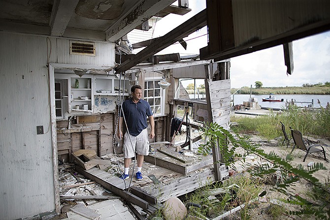 Gary Silberman stands for a picture as he guides reporters on a tour of his parent's home that was destroyed by Superstorm Sandy, in Lindenhurst, New York. After Silberman received nearly $17,000 in assistance from FEMA, the agency is demanding a return on the funds.