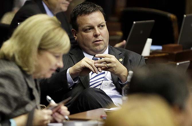 Missouri state Rep. Kevin Elmer, R-Nixa, sits in his seat on the House floor, Wednesday, Sept. 10, 2014, in Jefferson City, Mo.