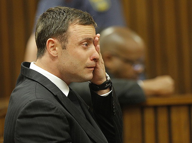 Oscar Pistorius cries in the dock in Pretoria, South Africa, Thursday, as Judge Thokozile Masipa reads notes as she delivers her verdict in Pistorius' murder trial.