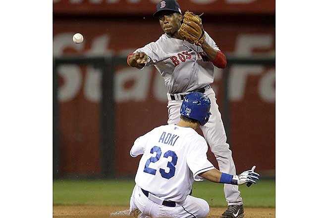 Boston Red Sox second baseman Jemile Weeks throws to first for the double play hit into by Kansas City Royals' Omar Infante, after forcing out Norichika Aoki during the fifth inning of a baseball game Thursday, Sept. 11, 2014, in Kansas City, Mo. 