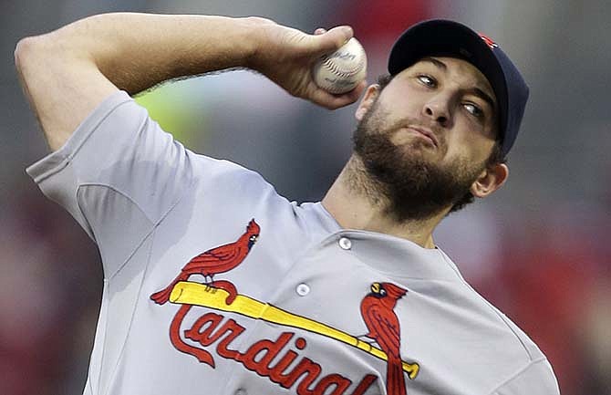 St. Louis Cardinals starting pitcher Michael Wacha throws against the Cincinnati Reds in the first inning of a baseball game, Tuesday, Sept. 9, 2014, in Cincinnati. 