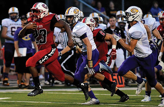 Elijah Pittman breaks free on Jefferson City's very first play from scrimmage during last Friday night's game against Columbia Hickman at Adkins Stadium.