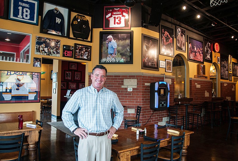 Mark "Archie" Archambault, owner of the recently-opened restaurant Archie's, poses for a photo inside his restaurant Thursday. Archie's was formerly a restaurant in the Arris franchise and is now going in a new direction as Archambault has complete control over the business.