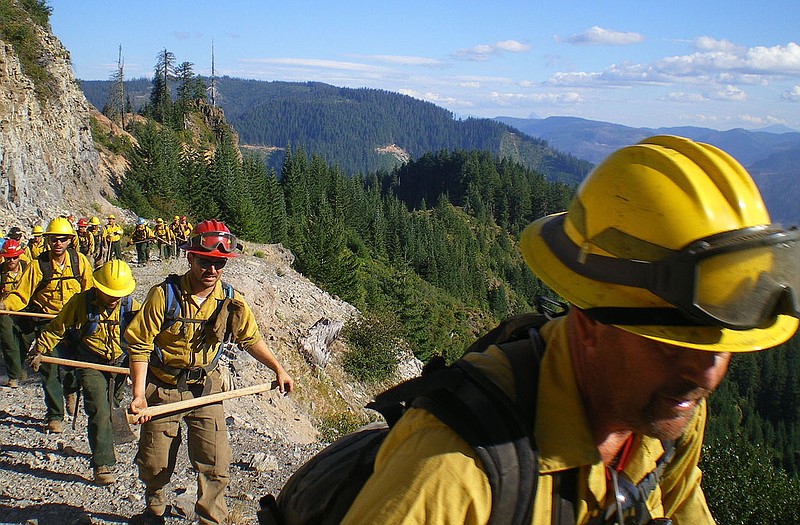 A Missouri Department of Conservation fire crew makes its way to a wildfire in the Northwest.