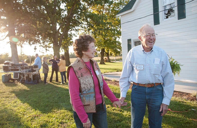 Clifford Borgelt, recipient of the 2014 Agriculture Community Service Award at the 2014 Town and Country Dinner, laughs during a conversation next to his friend Wanda Tuesday on Cedar Brook Farm in Fulton.