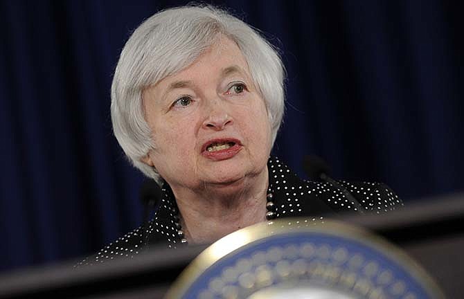 In this June 18, 2014, file photo, Federal Reserve Chair Janet Yellen speaks during a news conference at the Federal Reserve in Washington.