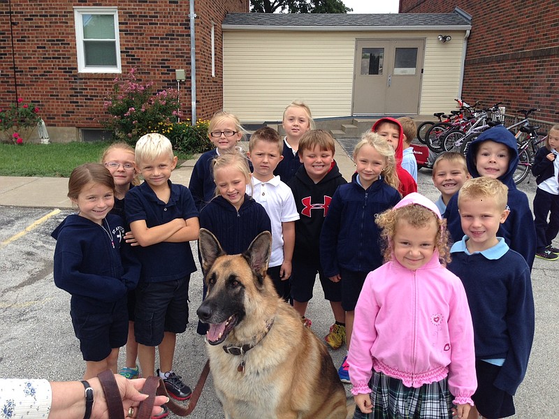 St. Andrew's kindergarten and first grade students visiting with Bubba.