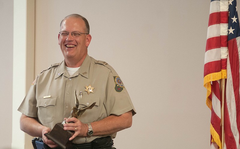 Callaway County Sheriff's Office Chief Deputy Darryl Maylee smiles as he accepts the 2014 G.W. Law Award from the Fulton Rotary Club on Wednesday inside Sir Winston's Restaurant.