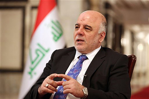 Iraq's Prime Minister Haider al-Abadi speaks during an interview with The Associated Press in Baghdad, Iraq, on Wednesday. Iraq's new prime minister says foreign ground troops are neither necessary nor wanted in his country's fight against the Islamic State group.