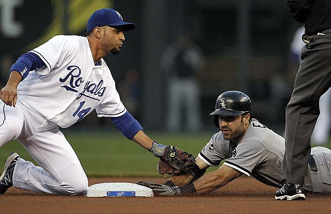 Chicago White Sox' Adam Eaton, right, is safe at second base with a double as Kansas City Royals second baseman Omar Infante, left, tags him with an empty glove in the first inning of a baseball game the at Kauffman Stadium in Kansas City, Mo., Tuesday, Sept. 16, 2014. Infante was unable to hold on to a throw from the outfield on the play.