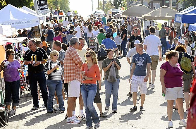 Crowds check out the vendor tents along Washington Street during the 2013 Oktoberfest in Jefferson City's Old Munichburg area.
