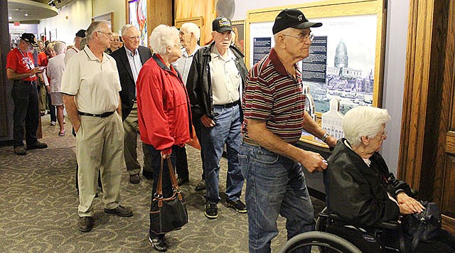 Veterans, their family members and volunteers wait in line to see the "Mail Call" exhibit Thursday at the National Churchill Museum in Fulton. The veterans were invited to see the exhibit for free.