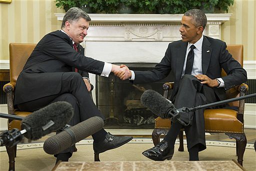 President Barack Obama, right, meets with Ukrainian President Petro Poroshenko in the Oval Office of the White House, on Thursday.
