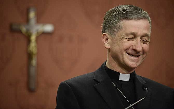 Newly appointed Archbishop of Chicago, Archbishop Blase Cupich speaks to the media after it was announced that he would replace Cardinal Francis George, retiring leader of the Chicago Catholic Archdiocese during a news conference in Chicago, Saturday, Sept. 20, 2014.