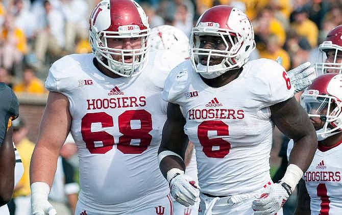 Indiana's David Kaminski, left, congratulates teammate Tevin Coleman after Coleman scored a touchdown during the first quarter of an NCAA college football game against Missouri, Saturday, Sept. 20, 2014, in Columbia, Mo.