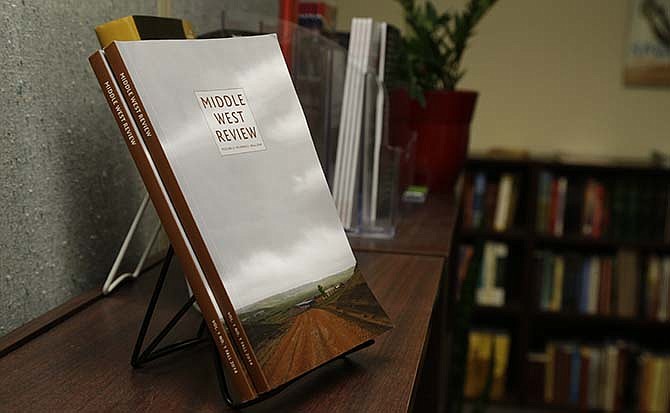 Copies of the Middle West Review are seen at the offices of the University of Nebraska Press in Lincoln, Neb., Friday, Sept. 19, 2014. The biannual journal has only 25 subscribers thus far, mostly Midwestern university libraries. But Joyce Gettman, a spokeswoman for the University of Nebraska Press, said new journals usually see a significant jump in subscribers after the first issues are distributed "and word spreads." 