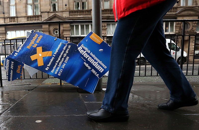A damaged Scottish independence referendum advertising board is seen in Edinburgh, Scotland, after voters have rejected independence and decided that Scotland will remain part of the United Kingdom. 