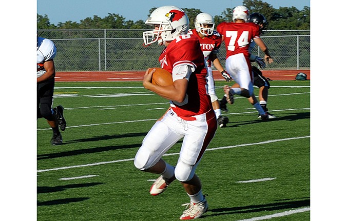 In this Aug. 17, 2012 News Tribune file photo, Tipton Cardinal Chad Stover carries the ball during the Blair Oaks Fooball Jamboree at the Falcon Sports Complex in Wardsville, Mo.