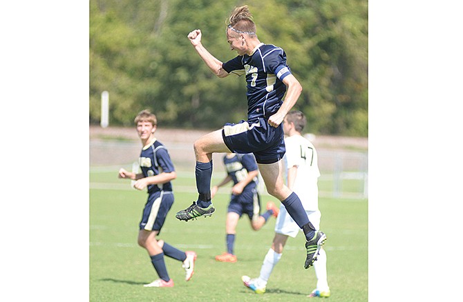 Helias' Ian Luebbert celebrates after scoring the goal that tied Saturday's game with Raymore-Peculiar at 2 in the
Capital City Invitational at the 179 Soccer Park in Jefferson City.