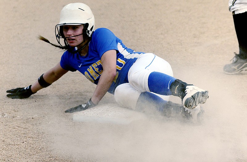 Sammey Bunch of the Fatima Lady Comets is safe at third during Tuesday night's game against the Helias Lady Crusaders at Duensing Field.