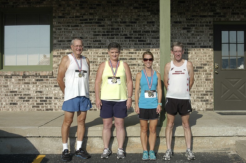 First Place winners of the four main categories of the Ozark Ham and Turkey Festival 5k walk / run are, from left, male walker J D Gattermeier (37:41), female walker Roberta Pate (39:45), female runner Heather Doyle (24:41) and male runner Kent Lang (18:59).