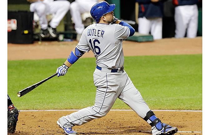 Kansas City Royals' Billy Butler watches his ball after hitting an RBI-single off Cleveland Indians starting pitcher Trevor Bauer in the fourth inning of a baseball game, Wednesday, Sept. 24, 2014, in Cleveland. Lorenzo Cain scored on the play.
