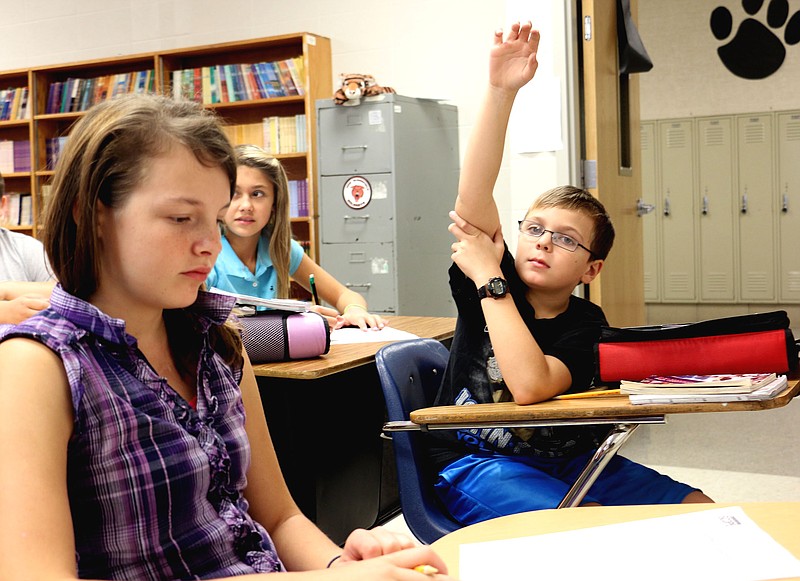 Sixth graders at New Bloomfield Middle School discuss essays they read in their core reading class. Reading is a focus for the school this year.