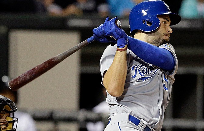 Kansas City Royals' Eric Hosmer hits a one-run single against the Chicago White Sox during the first inning of a baseball game in Chicago, Thursday, Sept. 25, 2014.