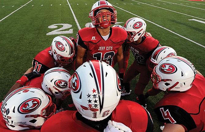 
Jefferson City defensive back Izaya Sands (13) breaks it down with his fellow defensive backs as the Jays get set to take on Rogers (Ark.) at Adkins Stadium on Friday, Sept. 19, 2014.