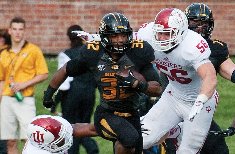 Missouri tailback Russell Hansbrough runs past Indiana defenders during last Saturday's game. 