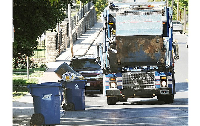 Trash is picked up on the city's east side Tuesday. Jefferson City is currently evaluating its scope of services with current contractor Allied Waste, which has been the sole solid waste service in the city since 2009 when the service became mandatory. The current contract with Allied Waste will end in October 2015.