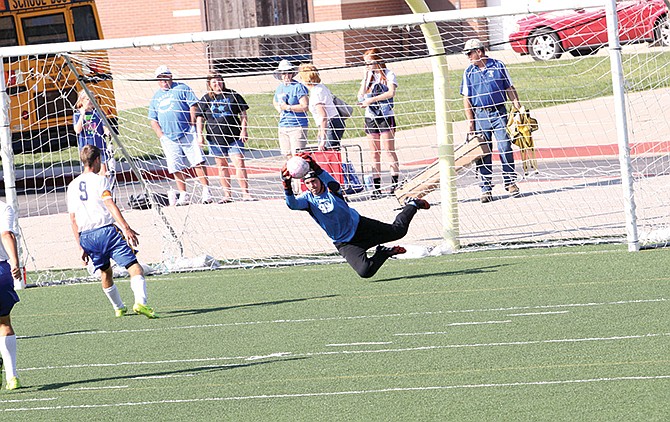 Fatima goalie Justin Bax makes a diving save during action Saturday at the Camdenton Tournament.