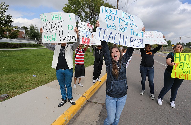 Students protest against a Jefferson County School Board proposal to emphasize patriotism and downplay civil unrest in the teaching of U.S. history, in front of their school, Jefferson High, in the Denver suburb of Edgewater.