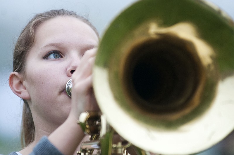 Baritone player with the Fulton High School Marching Band, Elizabeth Randall, performs a solo Thursday morning during a rehearsal.