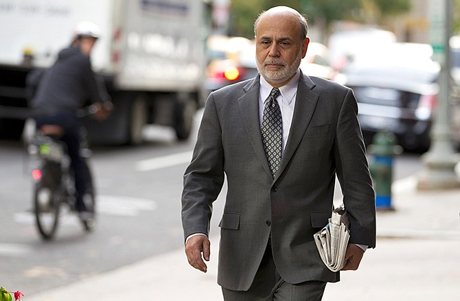 Former Federal Reserve Chairman Ben Bernanke arrives at the U.S. Court of Federal Claims in Washington, Thursday, Oct. 9, 2014, to testify in a suit on the US government's 2008 bailout of (AIG) American International Group Inc. in a trial of a lawsuit filed by the insurance giant's former CEO over the handling of the rescue.