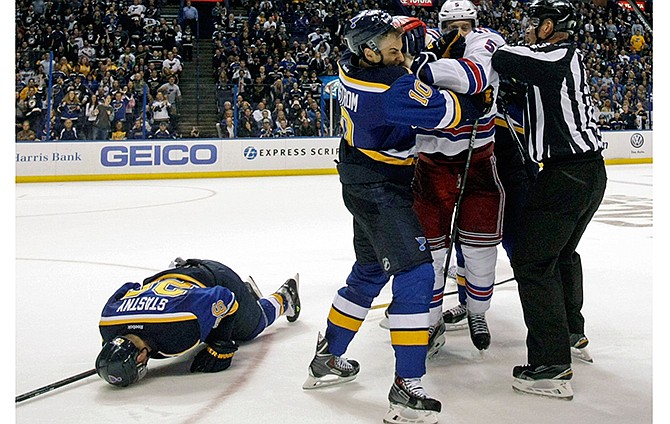 St. Louis Blues' Joakim Lindstrom (10) wrestles with New York Rangers' Dan Girardi (5) after Blues' Paul Stastny (26) was injured on a play in the second period of an NHL hockey game, Thursday, Oct. 9, 2014, in St. Louis. 